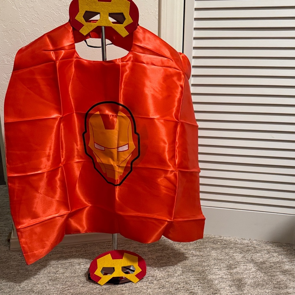 New. Superhero Cape and Mask Set - Red.  Reversible cape with 2 masks.